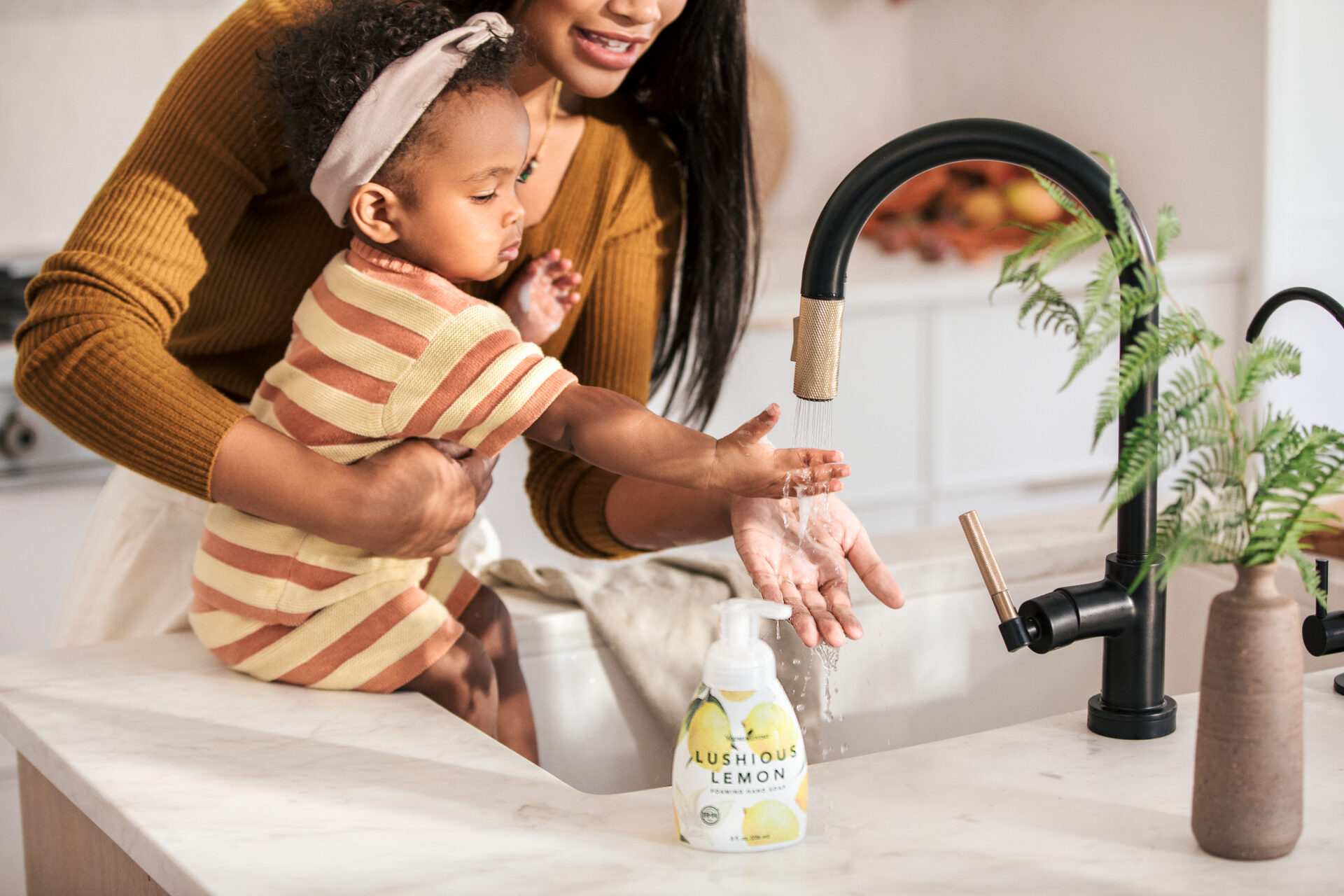 Mother and baby washing hands with Lushious Lemon Foaming Hand Soap - Young Living Lavender Life Blog 