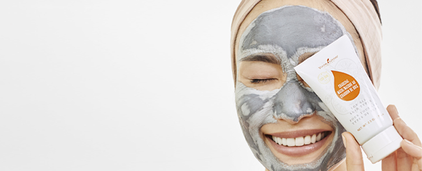 Woman smiling with Charcoal Mask on her face - Young Living Lavender Life Blog 