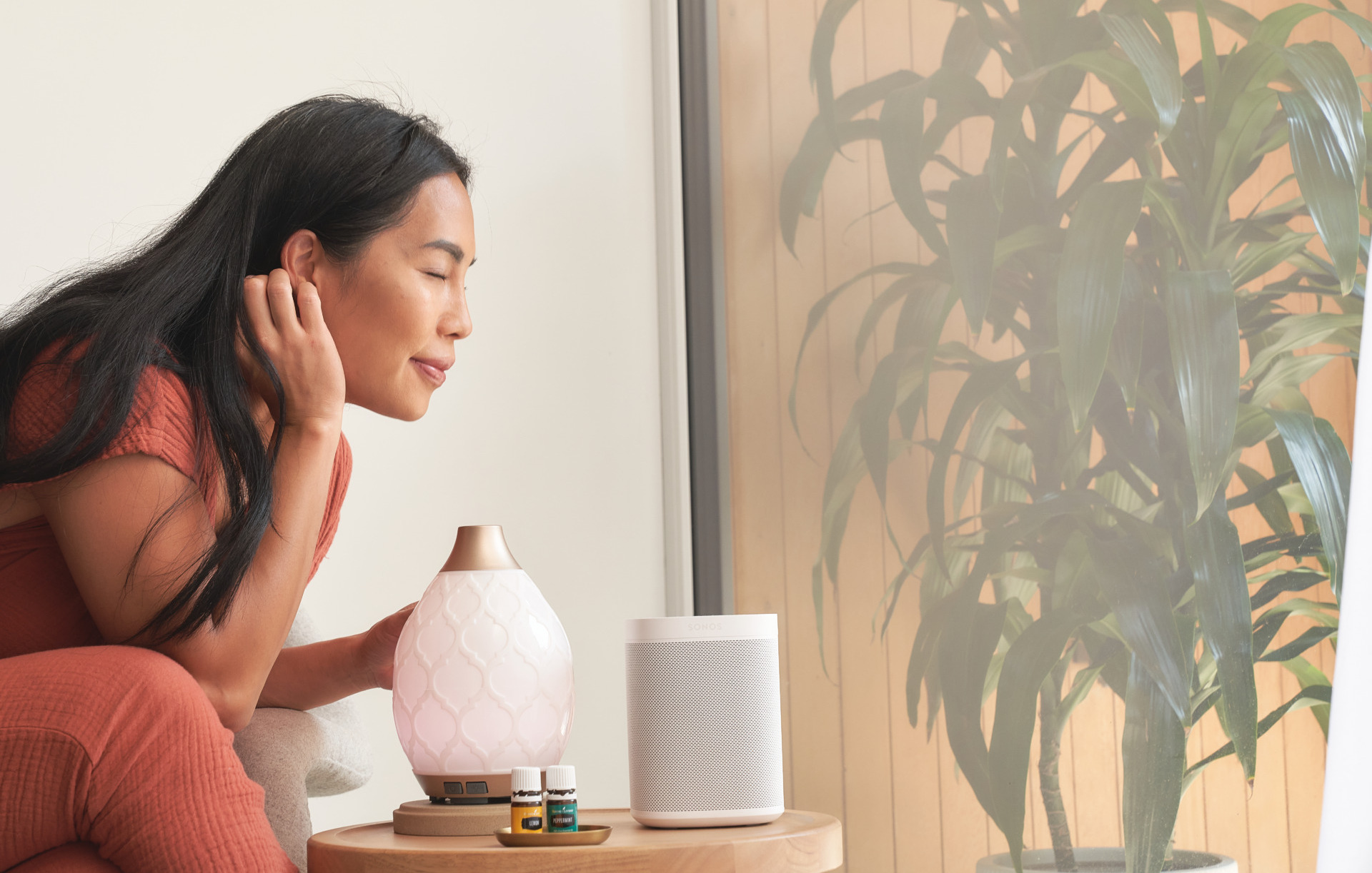 Woman smelling from diffuser - Young Living Lavender Life Blog 