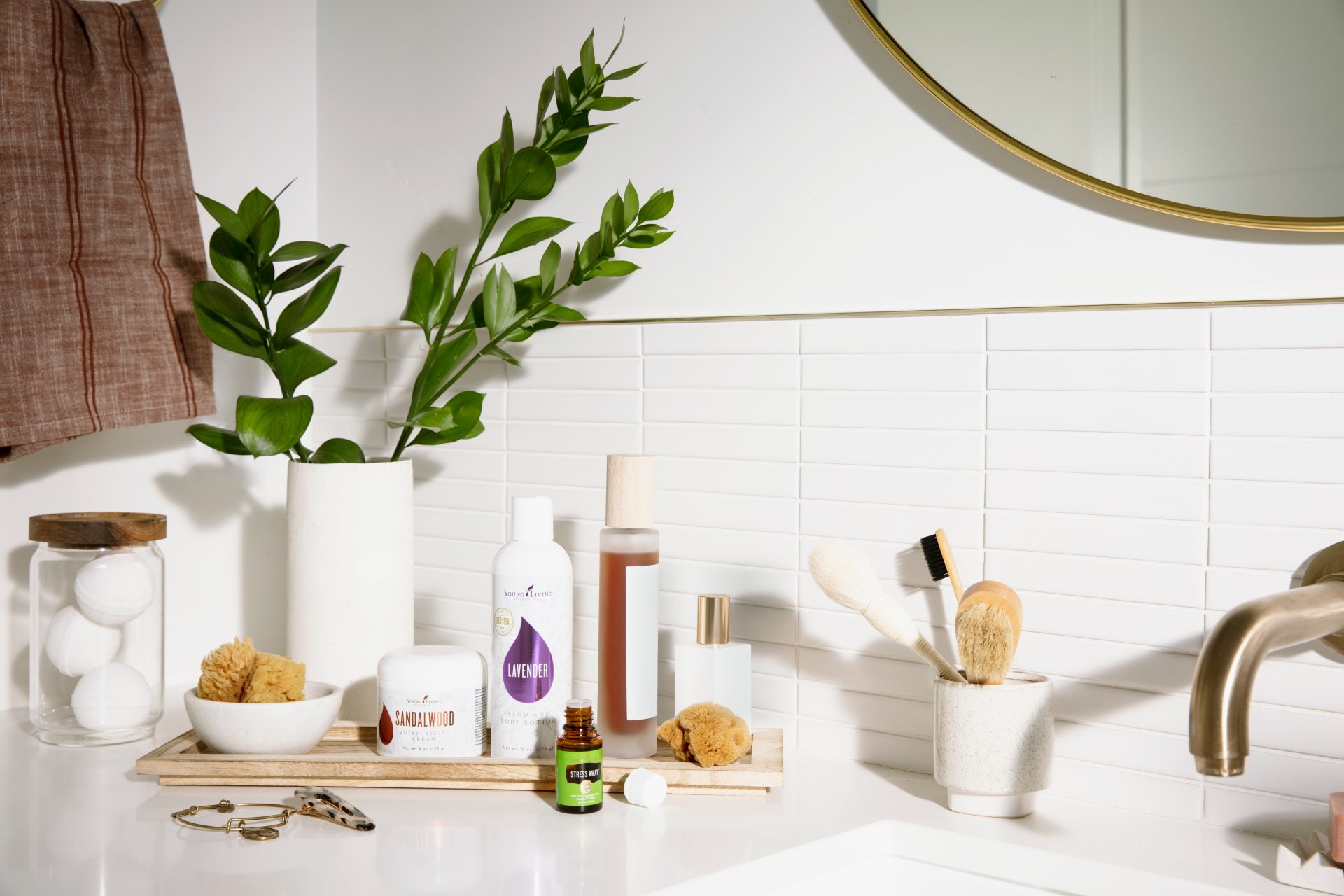 Young Living essential oil products on a bathroom vanity