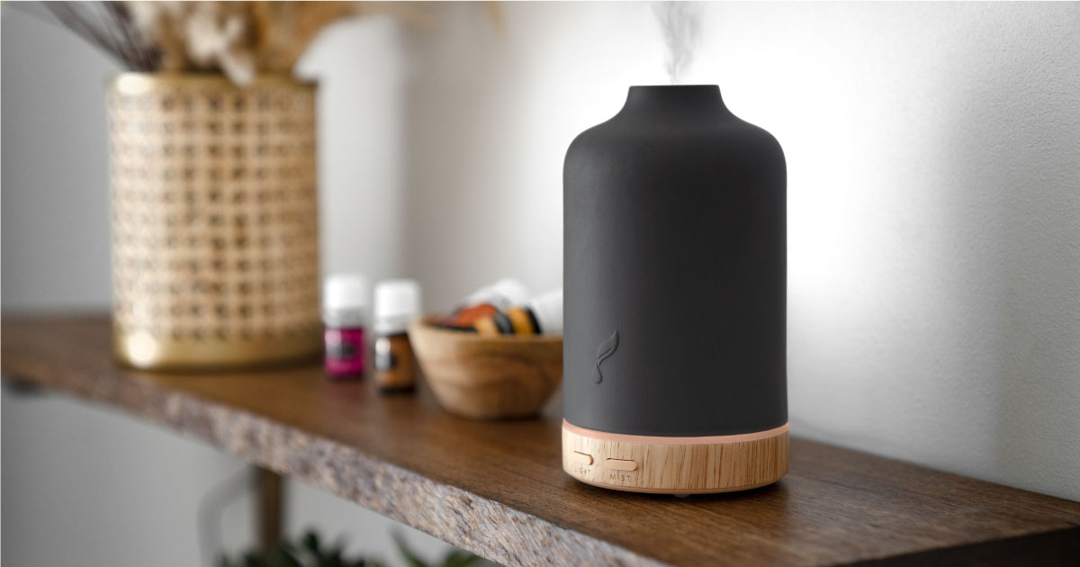 Ember Diffuser diffusing on a shelf next to YL essential oils - Young Living Lavender Life Blog 