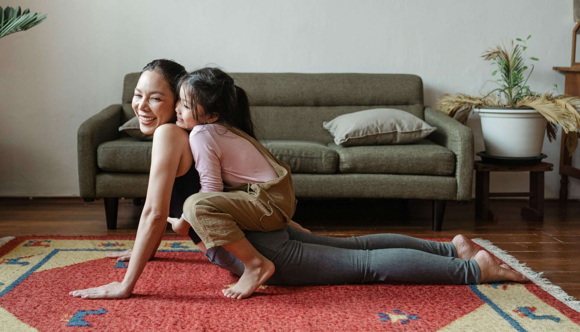 Woman doing yoga with daughter - Young Living Lavender Life blog 