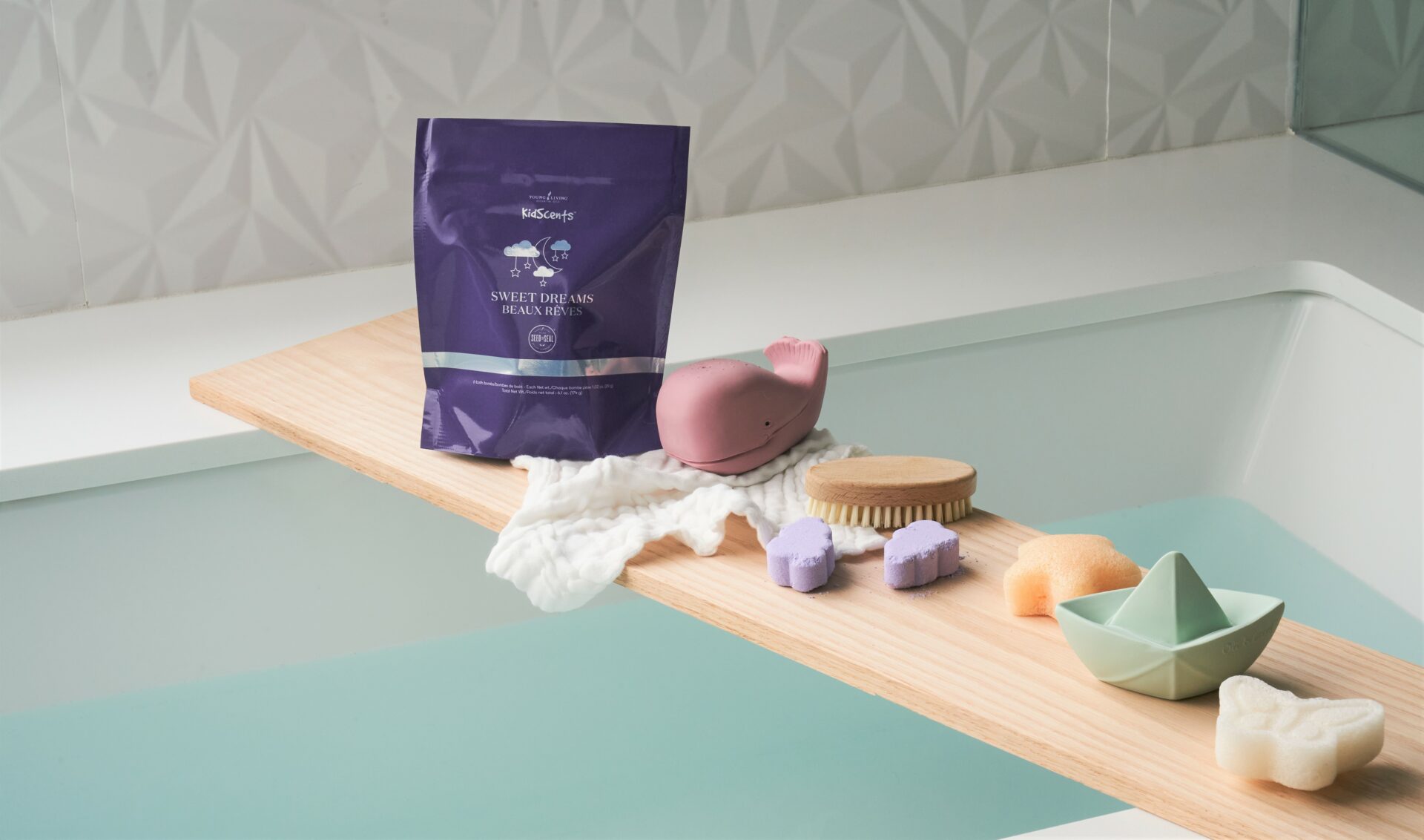 KidScents Sweet Dreams Bath Bombs sitting on wooden bath tray - Young Living Lavender Life blog 