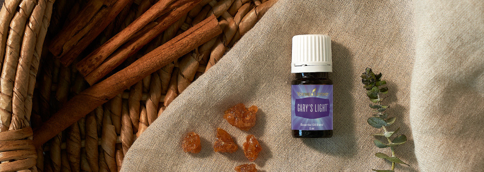 Gary's Light Essential Oil Blend sitting on linen cloth next to frankincense resin and botanical - Young Living Lavender Life blog 
