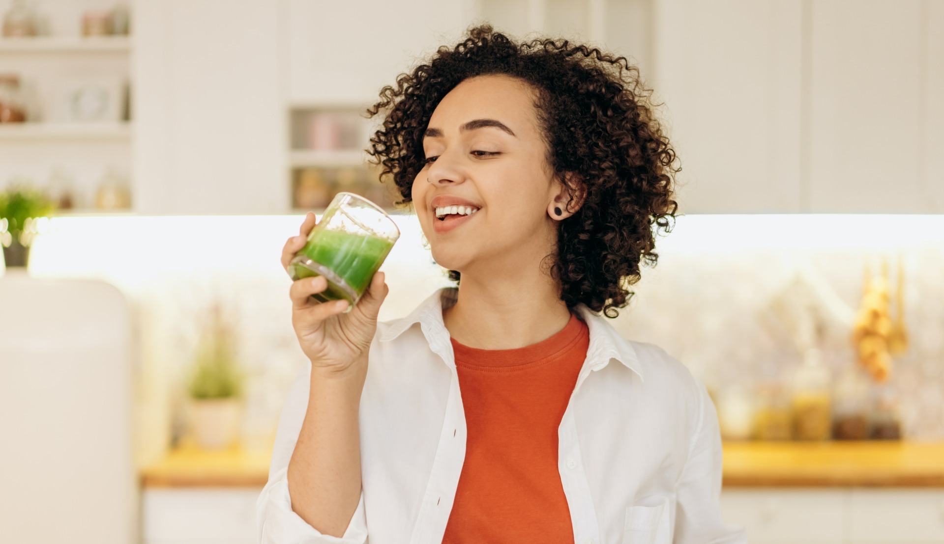 Woman drinking green smoothie - Young Living Lavender Life Blog 